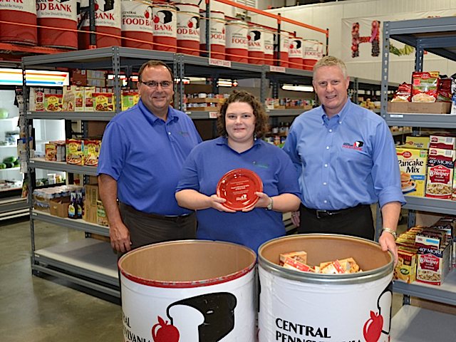 Greg Royer, CEO, Royer’s Flowers & Gifts; Jackie Dahms, manager, Royer’s West York store; Joe Arthur, executive director, Central Pennsylvania Food Bank. The West York store was recognized in 2013 for collecting the most pounds of food among Royer’s 17 locations.