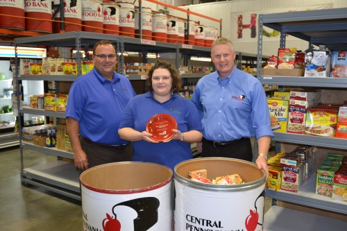From left, Greg Royer, CEO, Royer’s Flowers & Gifts; Jackie Dahms, manager, Royer’s West York store; Joe Arthur, executive director, Central Pennsylvania Food Bank. The West York store was recognized for collecting the most pounds of food among Royer’s 17 locations.